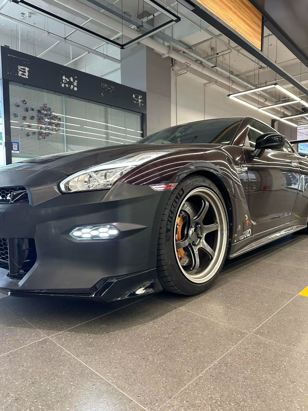 TCP Style of Pp Material Is Used for Nissan Gtr 35 2024 Front and Rear Bumper Diffuser Spoiler Hood Body Kit.